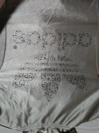 Chaqueta Adidas dorada y negra