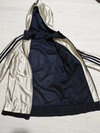 Chaqueta Adidas dorada y negra