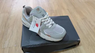 New Balance Bambas Running Doradas y Grises