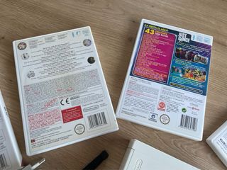 Nintendo Wii + Mando + Nunchuk + 5 Juegos
