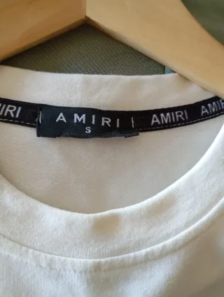 Sudadera Amiri blanca con salpicaduras.