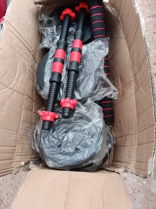 Juego de pesas con mangos 10 kilos cada mancuerna