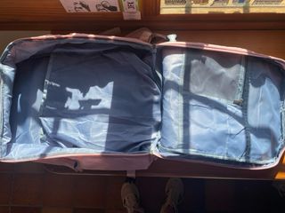 Mochila cabina avión rosa