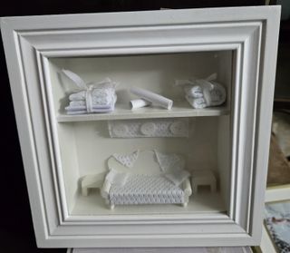 Quadro con interno in miniatura di camera da letto