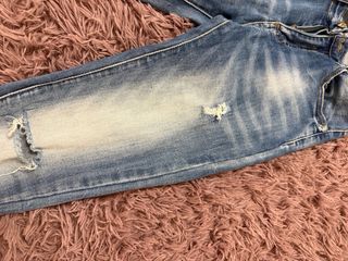 Jeans skinny vita alta strappati