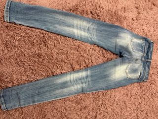 Jeans skinny vita alta strappati