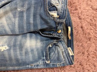 Jeans skinny vita alta strappati