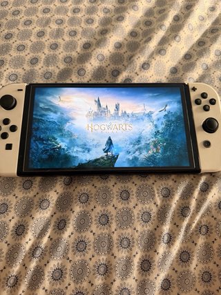 Nintendo Switch OLED Blanca mas 4 juego   Hogwars