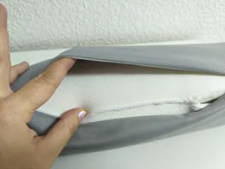 Cojín cilíndrico gris con vibración