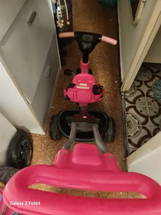 Triciclo infantil rosa y negro