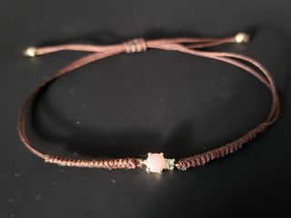 Pulsera Tous oro con gema