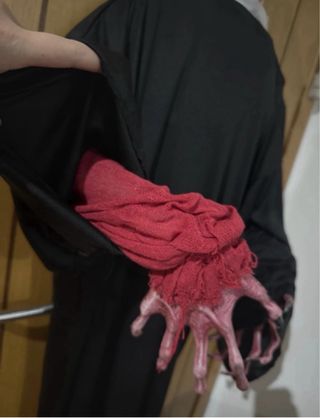 Scary hanging clown with light eyes