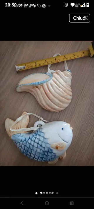 Decorazioni a forma di pesce e conchiglia