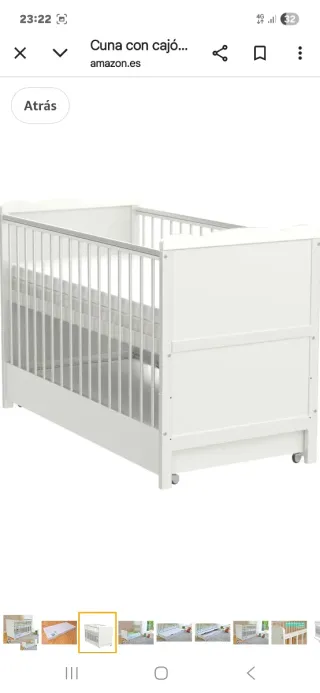 Cuna de bebé blanca con cajón