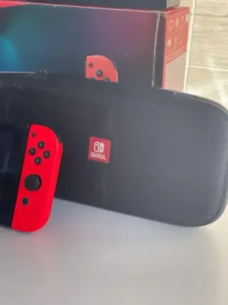 IMPECABLE Nintendo switch v2 con accesorios