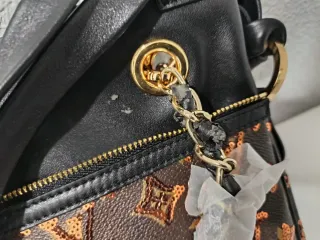 Borsa Louis Vuitton Monogram in tela marrone e oro
