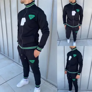 Tuta sportiva nera con dettagli verdi