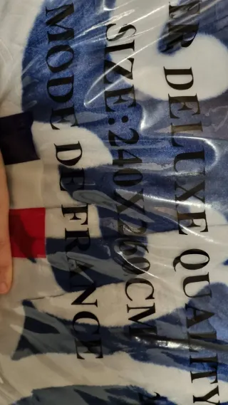 Manta de forro polar azul y blanco