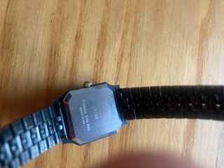 Reloj Lotus de pulsera de acero esfera blanca.