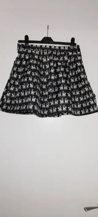 Falda palas con  vuelo gatos T.S