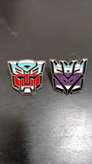 Juego 2 pins Transformers