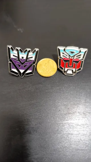 Juego 2 pins Transformers