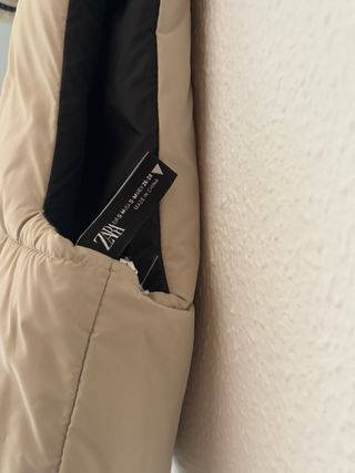 Chaleco reversible beige y negro