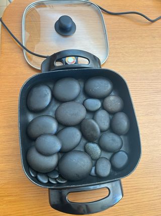 Olla y piedras para masaje