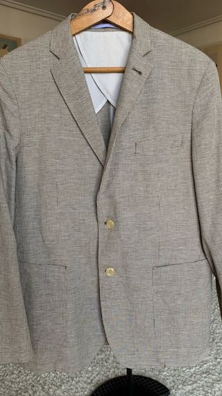 Americana de primavera beige y forro azul .