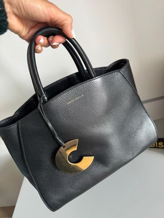 Borsa Coccinelle vera pelle nera con logo dorato