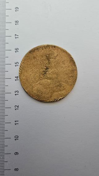 Moneda antigua con retrato de hombre