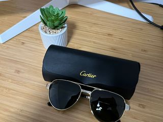 Gafas de sol Cartier aviador doradas y negras