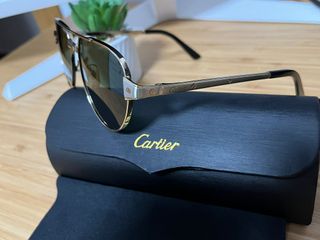 Gafas de sol Cartier aviador doradas y negras