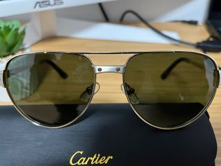 Gafas de sol Cartier aviador doradas y negras