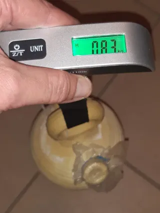 OF Peso balanza portatil viaje Pesa 50 Kg. En mano