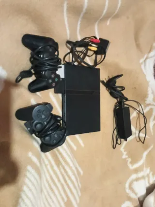 PS2+2 mandos+2 memory cards 8mb