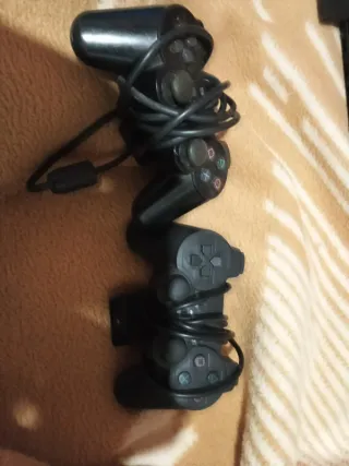 PS2+2 mandos+2 memory cards 8mb