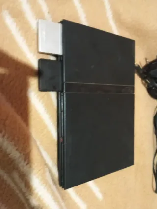 PS2+2 mandos+2 memory cards 8mb