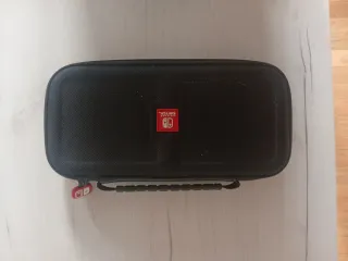 Funda Nintendo switch con caja de cartuchos gratis