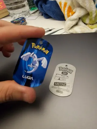Metal tags pokemon lugia y poochyena