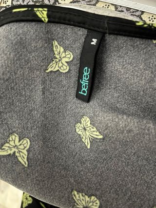 Vestito nero con farfalle