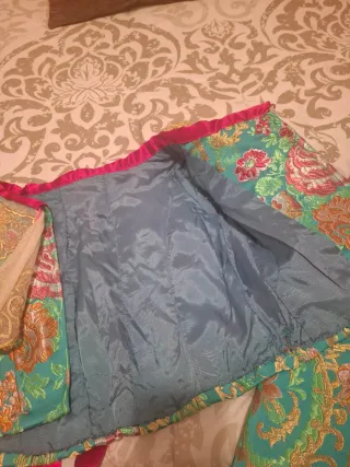 Traje de fallera verde.