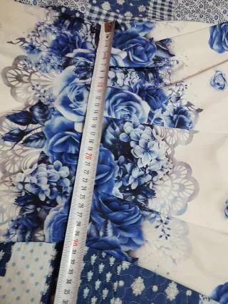 Tuta corta a fiori blu, tg. S / M. Nuova.