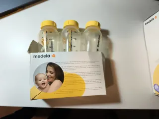 Medela sacaleches eléctrico de dos fases + 3 botes