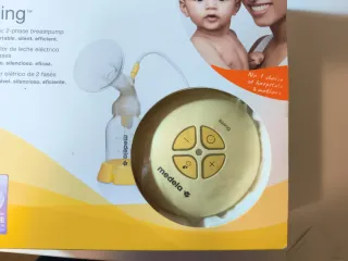 Medela sacaleches eléctrico de dos fases + 3 botes