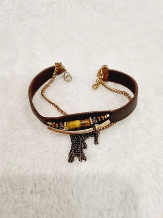 Pulsera  marrón y dorada en perfecto estado