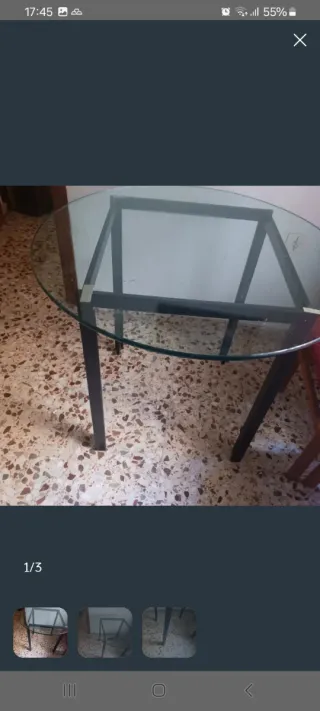 Mesa redonda de cristal y hierro