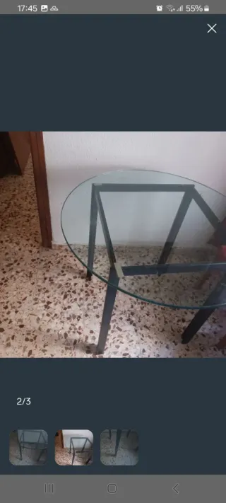Mesa redonda de cristal y hierro