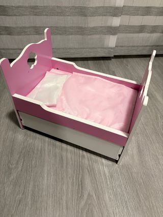 Cuna de juguete rosa con cajón