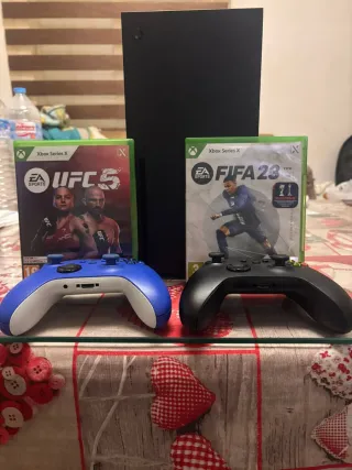 Xbox series x con 2 mandos y dos juegos